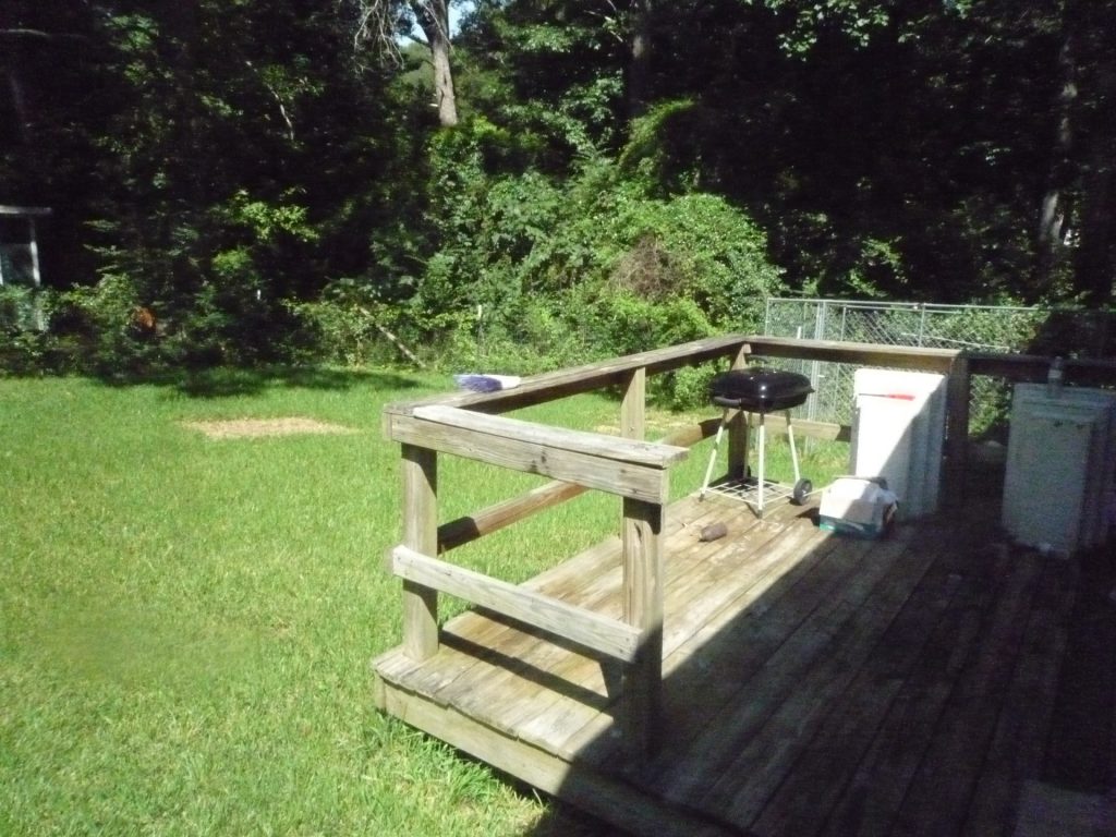 deck and fenced back yard